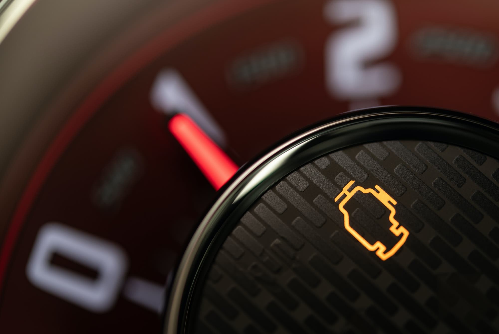 Check engine control light on a vehicle dashboard